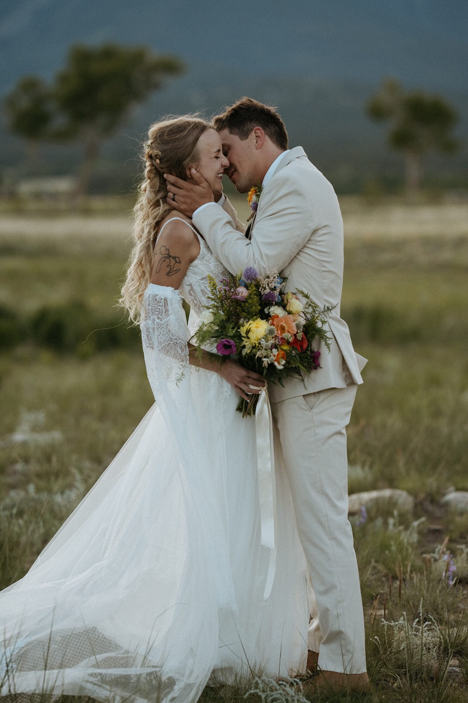 Bride and groom steal a moment away during sunset after their wedding ceremony