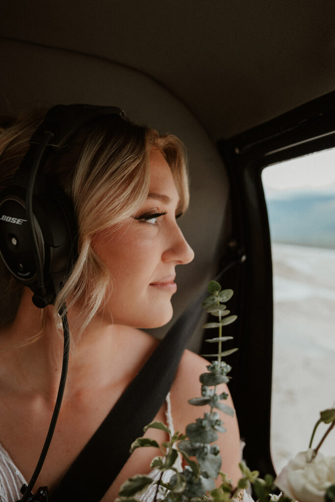 Brides portraits in a helicopter from Outbound Heli for their Alaska helicopter elopement at Knik Glacier