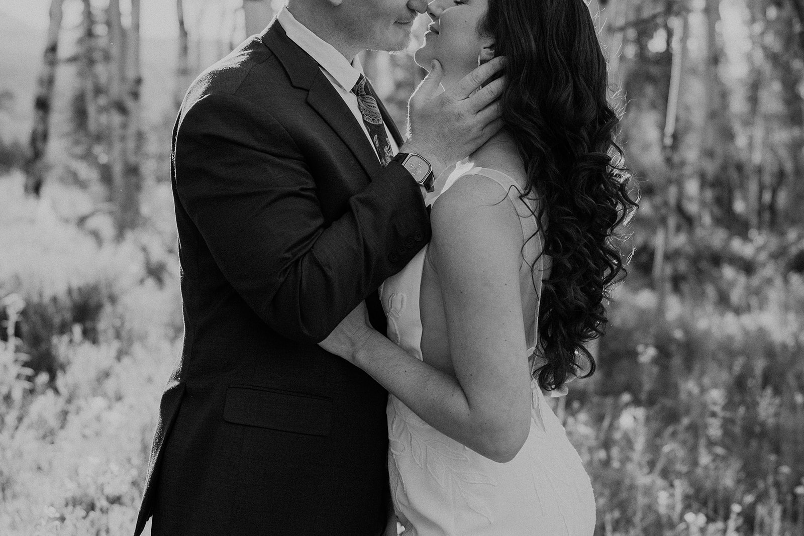 Close up black and white photo of a bride and groom kissing during their Breckenridge Colorado elopement photos