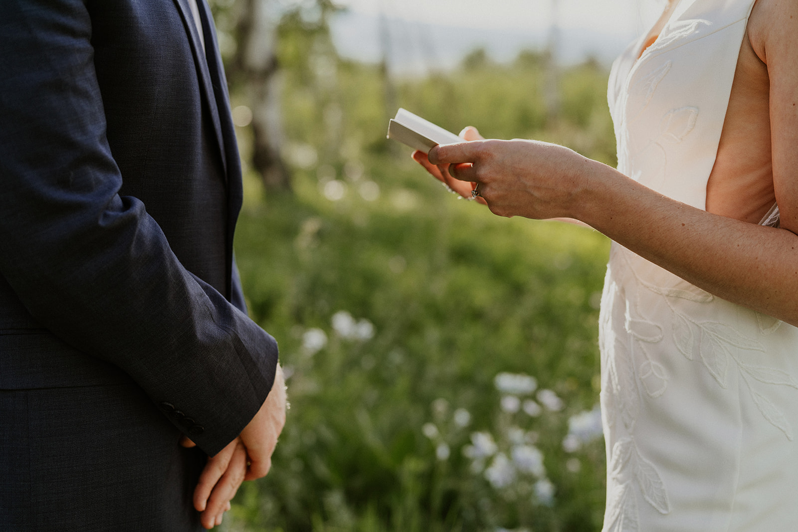 Close up shot of a bride reading her vows to her groom during their Breckenridge Colorado elopement