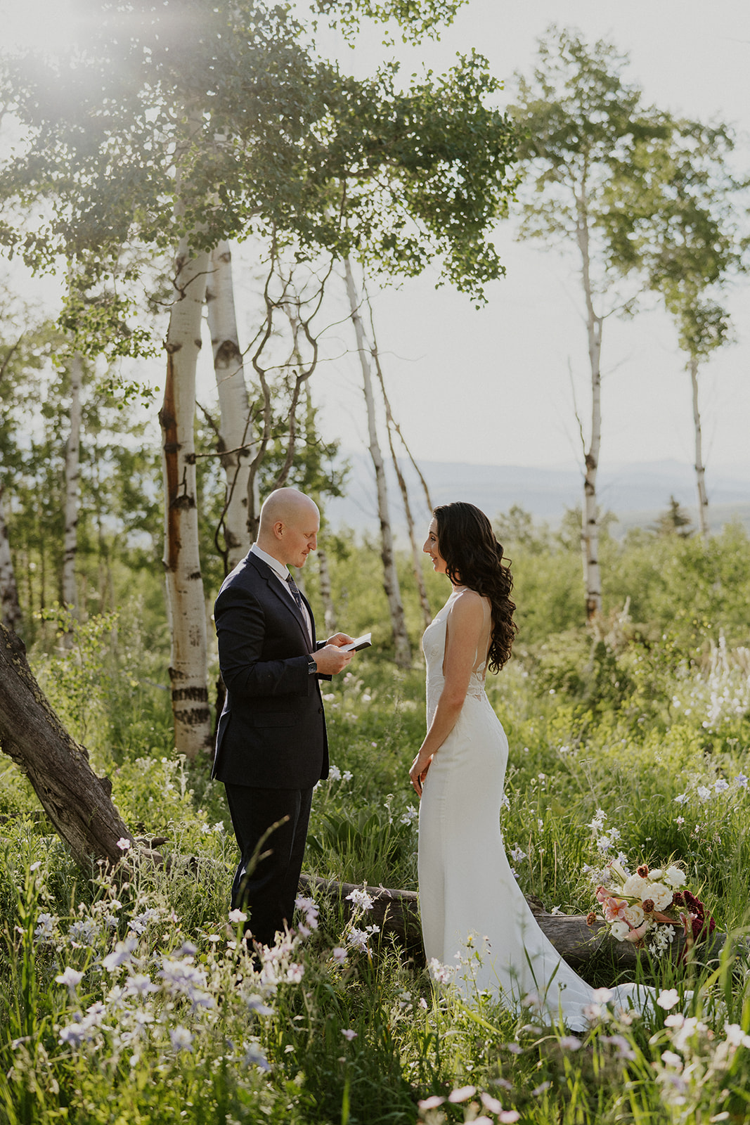 Groom reading his vows to his bride during their Breckenridge Colorado elopement