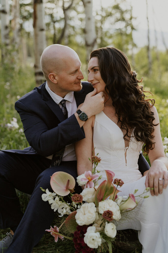 Close up of a groom holding onto a brides face 