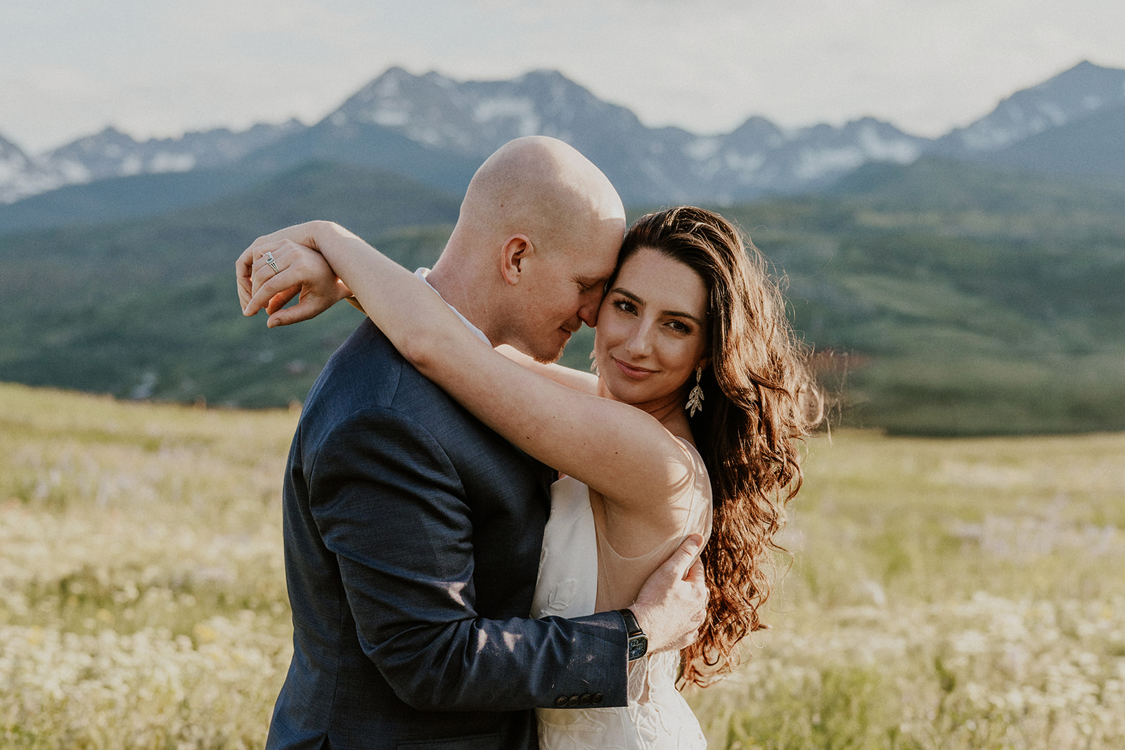 Bride and groom holding onto each other during their intimate Breckenridge Colorado elopement