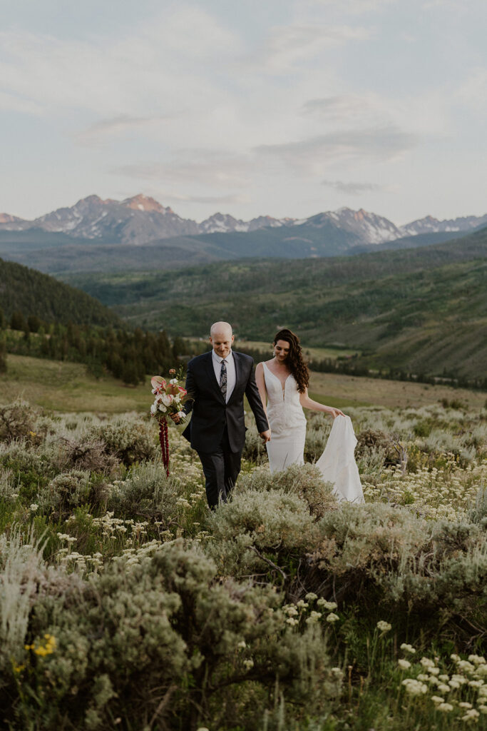 Bride and groom walking through the alpine meadows for their Breckenridge Colorado elopement photos