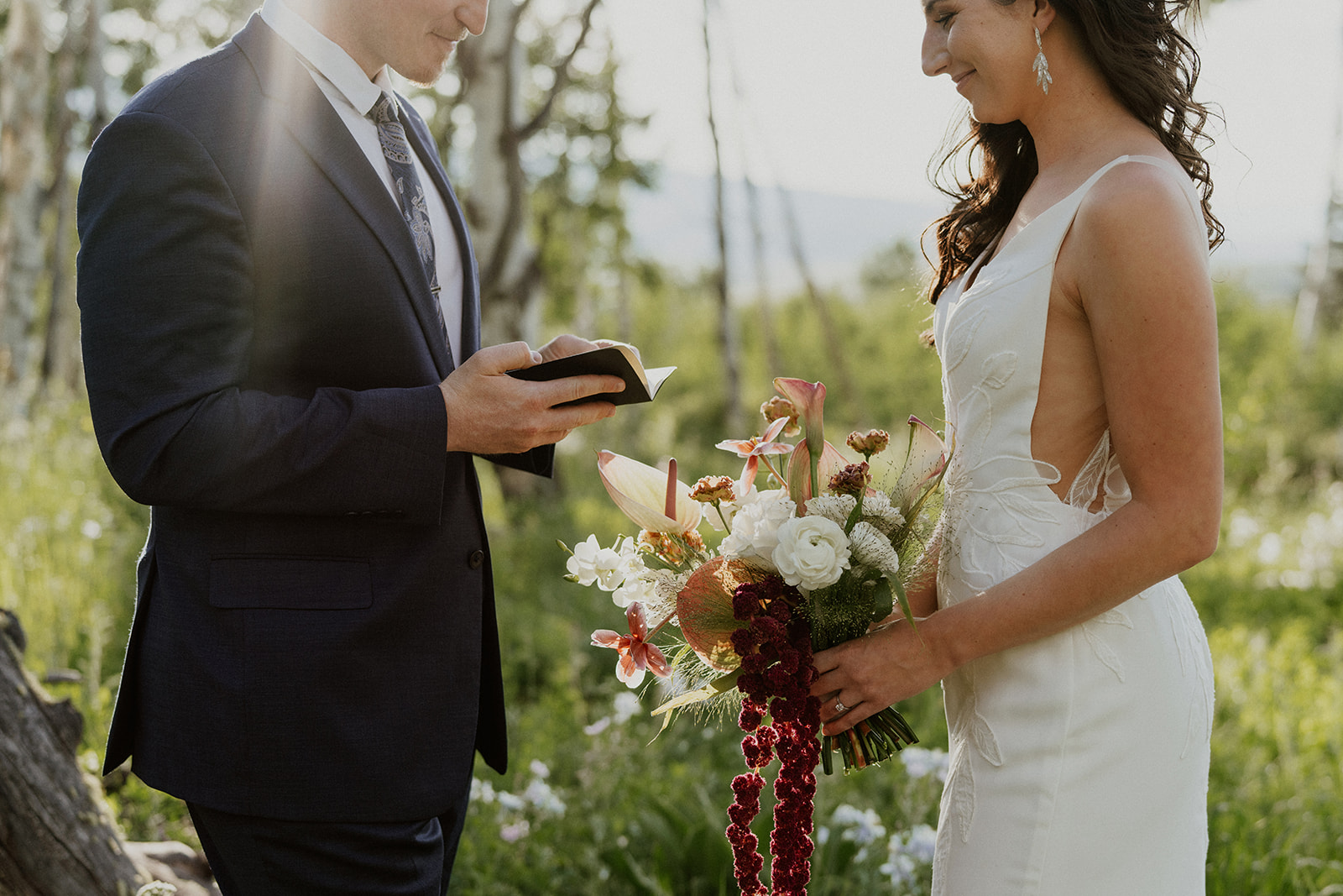 Close up shot of a groom reading his vows to his bride