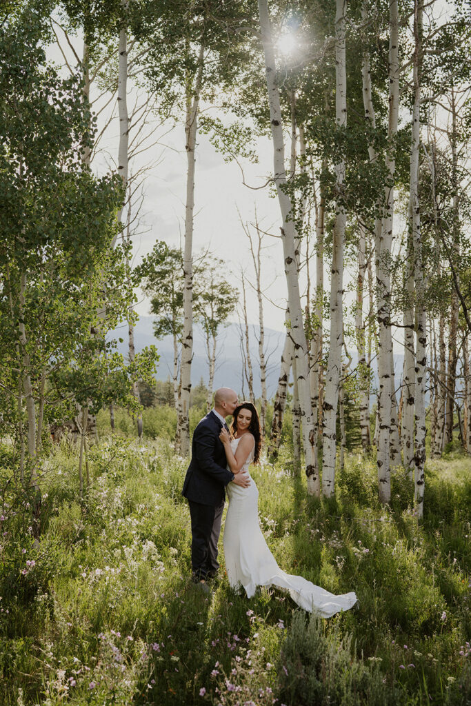 Groom kissing his bride during their Breckenridge Colorado elopement photos