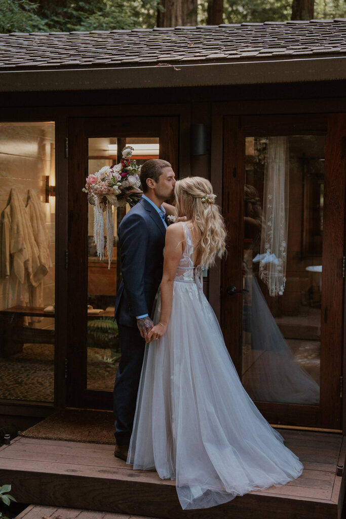 Groom kissing the brides forehead during their Glen Oaks Big Sur elopement