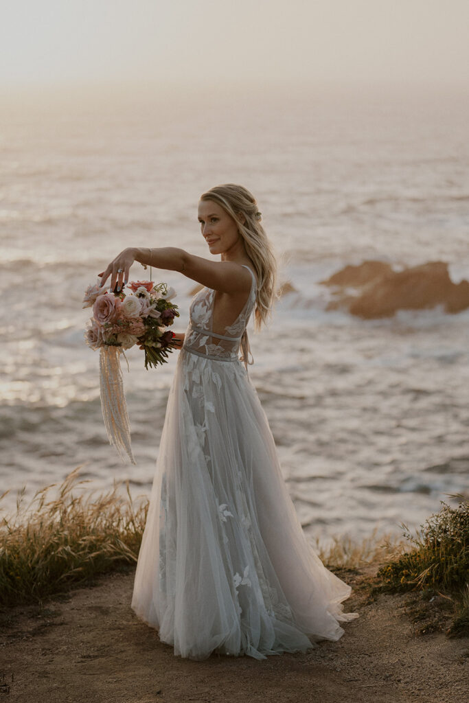 Bride posing at sunset in Big Sur, California