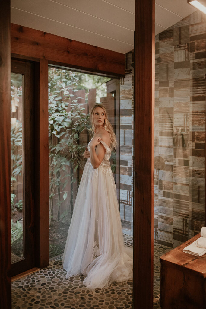 Bride getting ready for her elopement at Glen Oaks in Big Sur, California