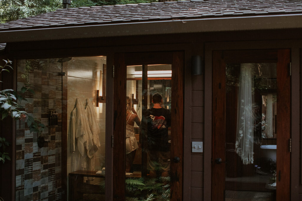 Bride and groom getting ready together at Glen Oaks in Big Sur, California