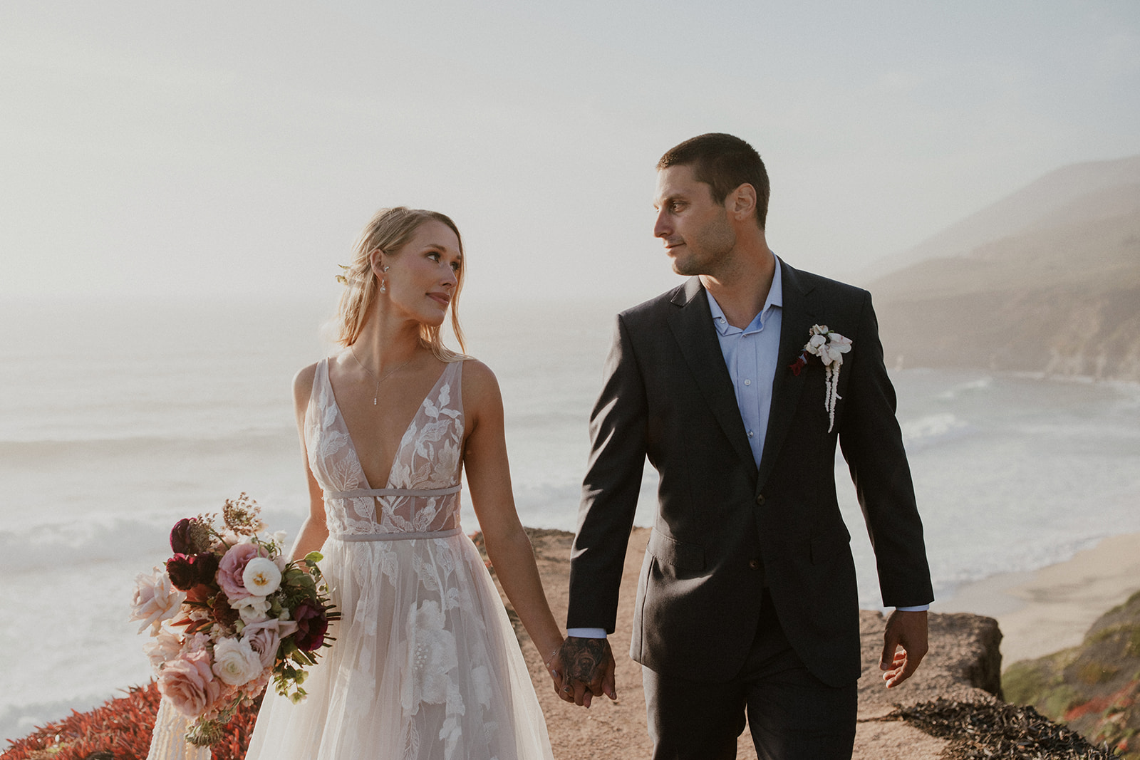 Bride and groom holding hands during their Big Sur elopement photos