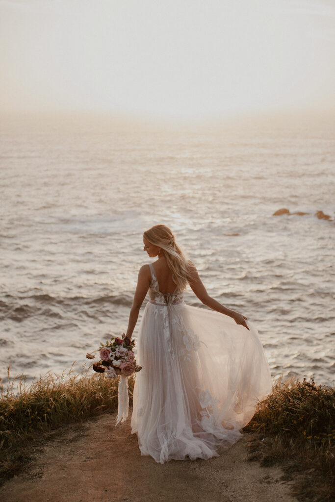 Bride posing at sunset in Big Sur, California