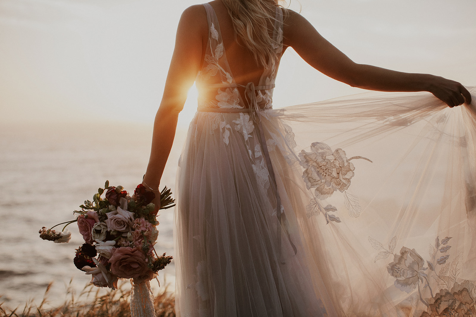 Bride posing at sunset in Big Sur, California