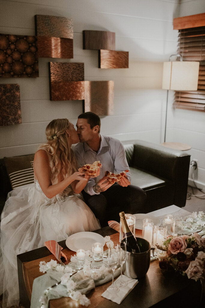 Bride and groom kissing during their intimate Big Sur elopement dinner at Glen Oaks