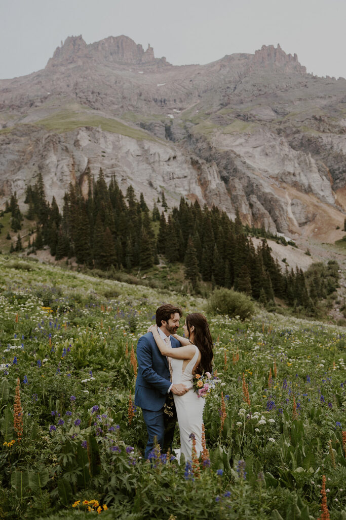 Colorado wildflower elopement bride and groom portraits