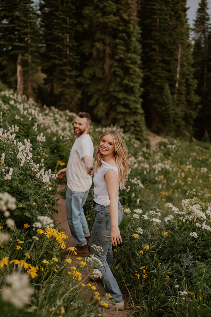 Couple holding hands and walking the trails