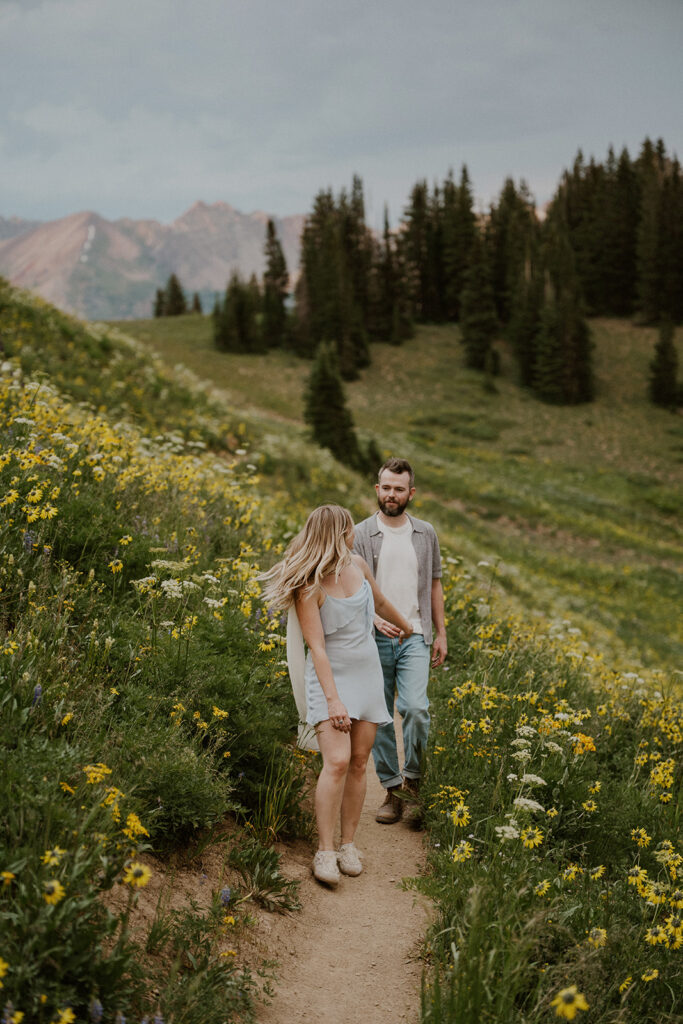 Couple walking hand in hand on the Crested Butte trails