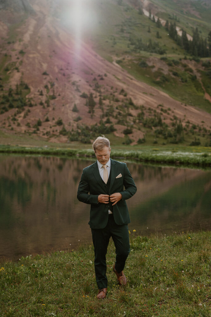 Groom posing for his San Juan Mountains elopement photos in Colorado