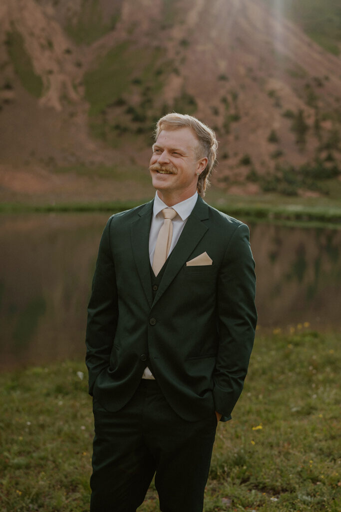 Groom posing for his San Juan Mountains elopement photos in Colorado
