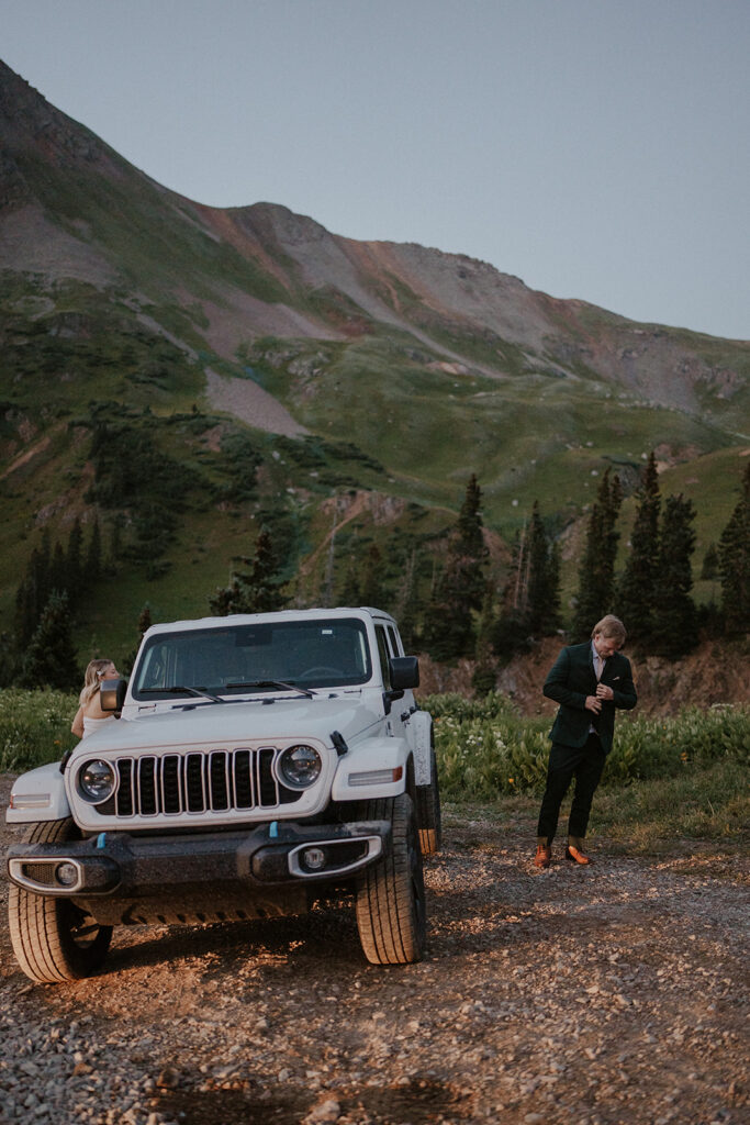 Bride and groom getting ready by their keep for their Colorado mountain elopement