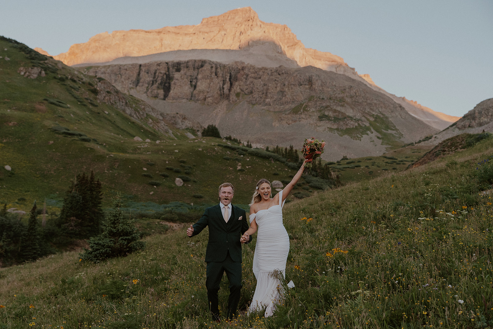 Bride and groom excited during their Colorado mountain elopement in the San Juans