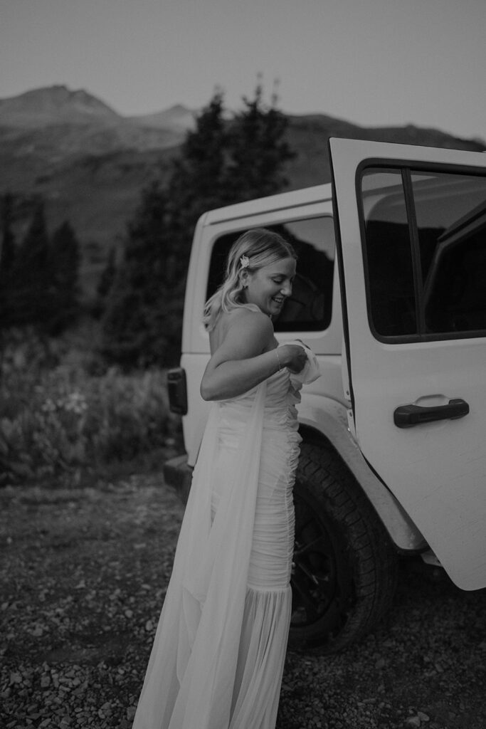 Black and white photo of a bride getting ready for her San Juan Colorado mountain elopement