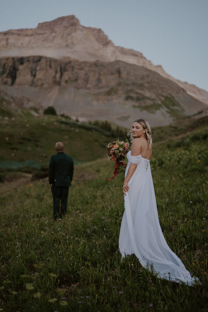 Bride about to share a first look with the groom in the Colorado San Juan mountains