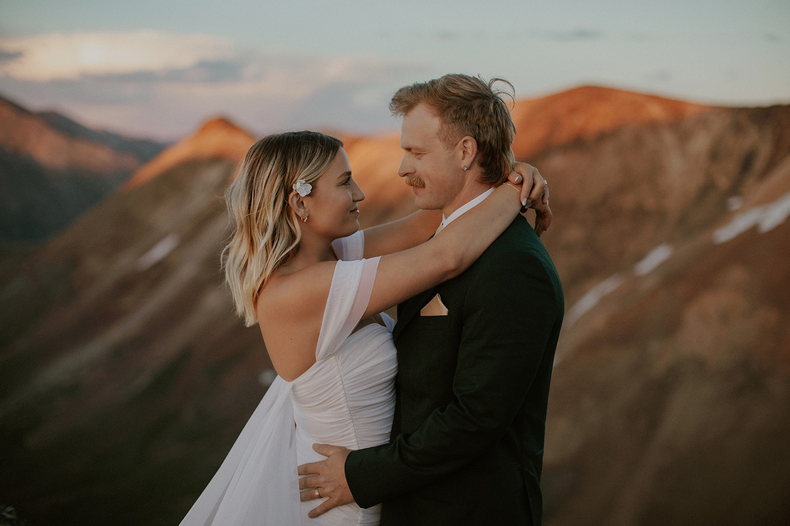 Bride and groom posing in the San Juan mountains for their elopement photos in Colorado