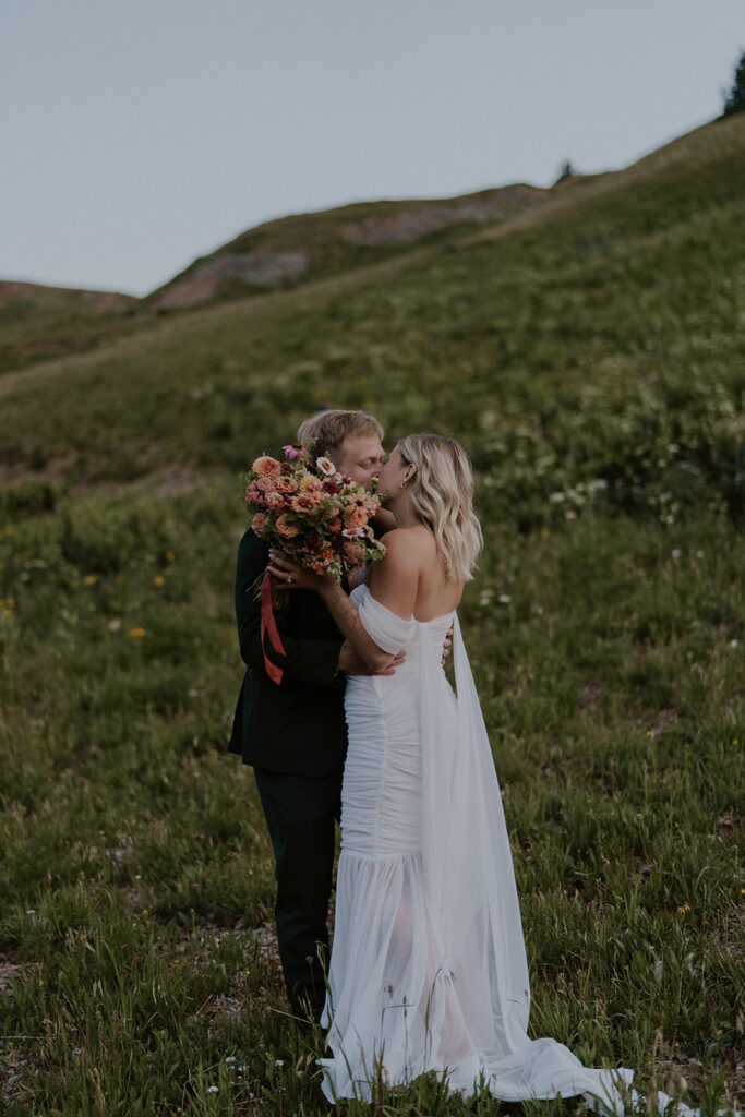 Bride and groom kissing after their first look