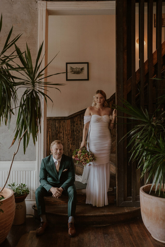 Bride and groom posing at Western Hotel in Ouray