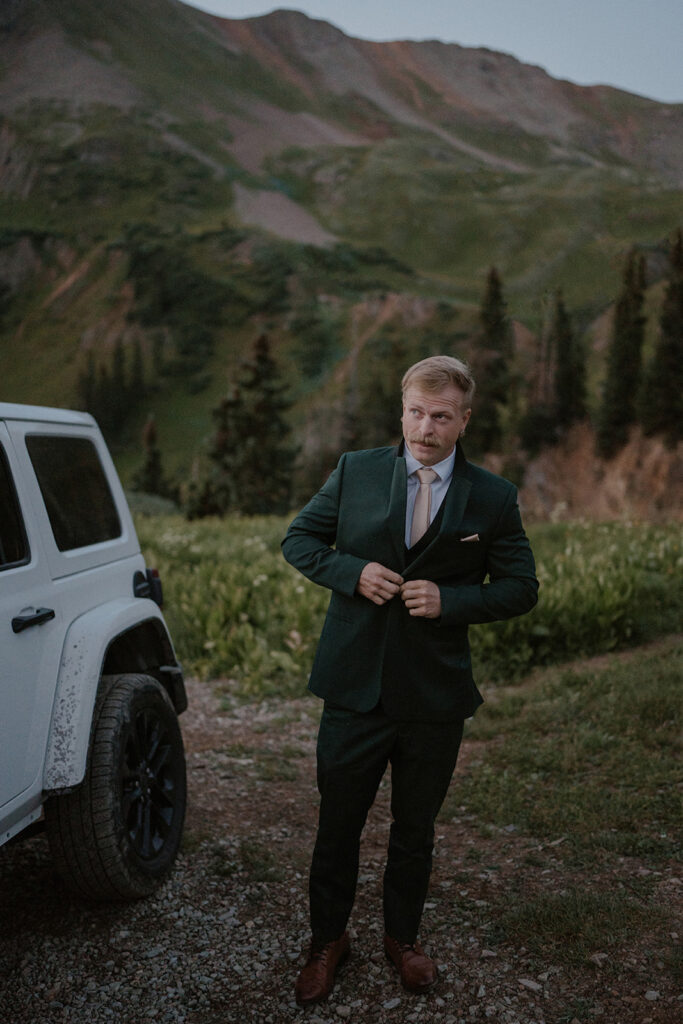 Groom getting ready for his intimate San Juan mountain elopement in Colorado