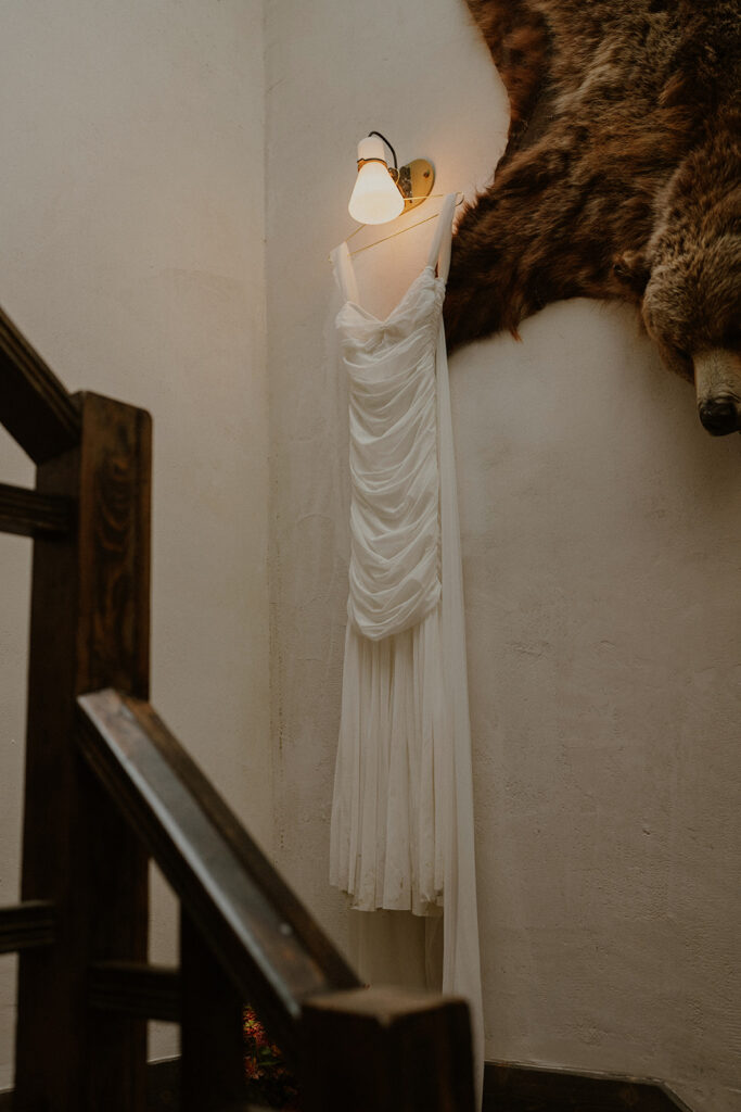 Brides dress hanging on the wall at Western Hotel in Ouray 