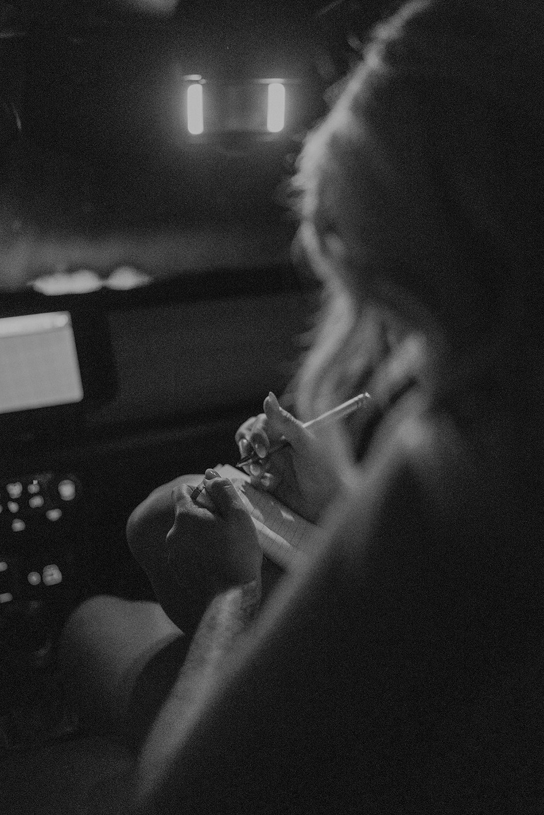 Bride writing her vows in her jeep before her San Juan mountains elopement in Colorado