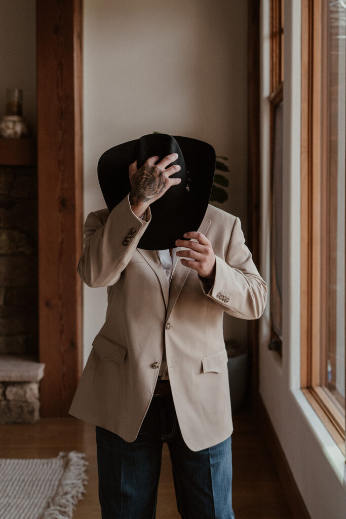 Groom gets ready in a Breckenridge Airbnb before a Lake Dillon wedding ceremony