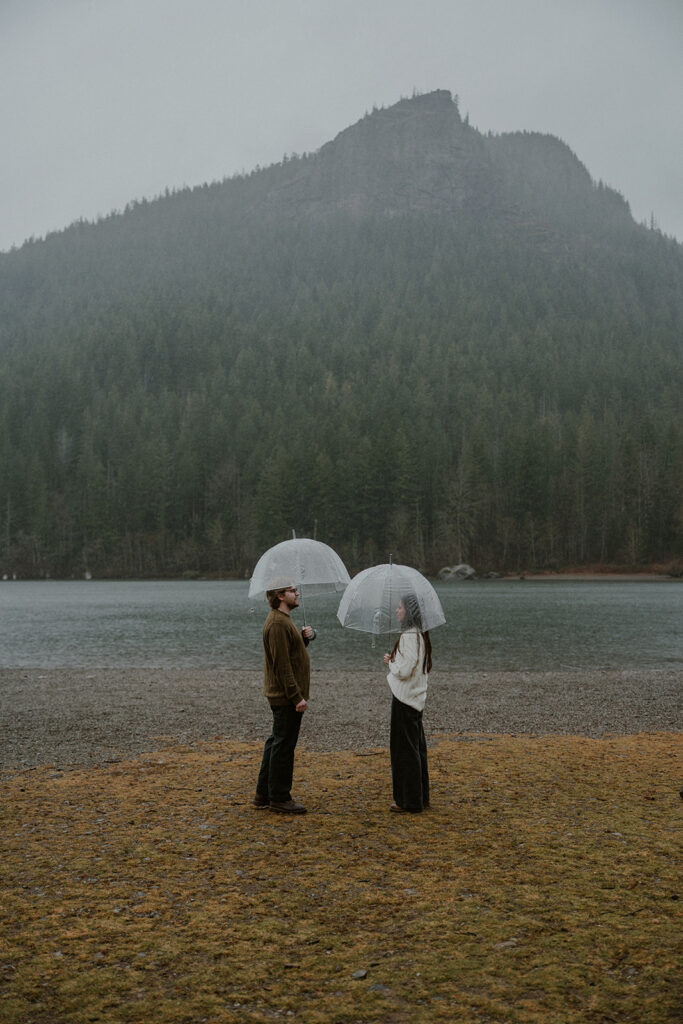 Moody and rainy Rattlesnake Lake engagement photos in Washington State