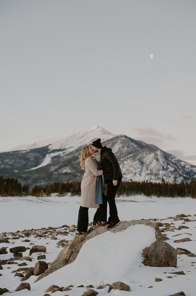Snowy sunrise engagement photos in Colorado at Lake Dillon