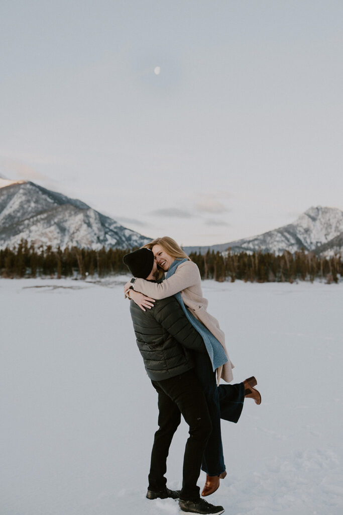 Snowy sunrise engagement photos in Colorado at Lake Dillon