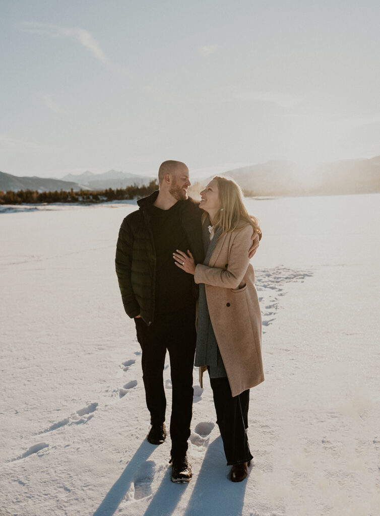 Snowy sunrise engagement photos in Colorado at Lake Dillon