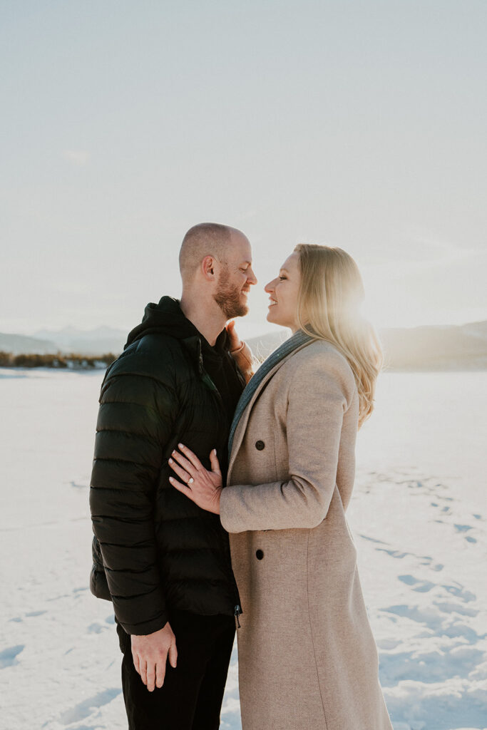 Snowy Colorado engagement photos during sunrise