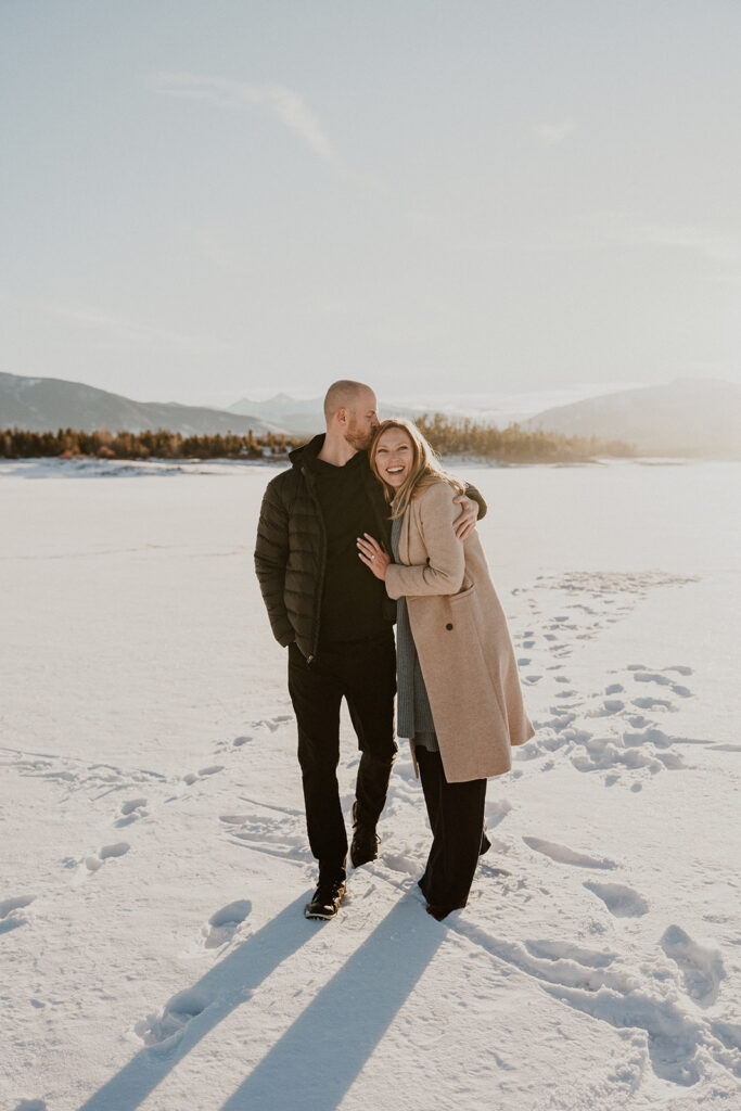 Snowy Colorado engagement photos during sunrise