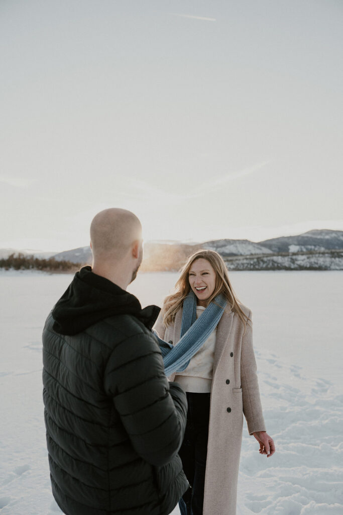 Snowy sunrise engagement photos in Colorado at Lake Dillon