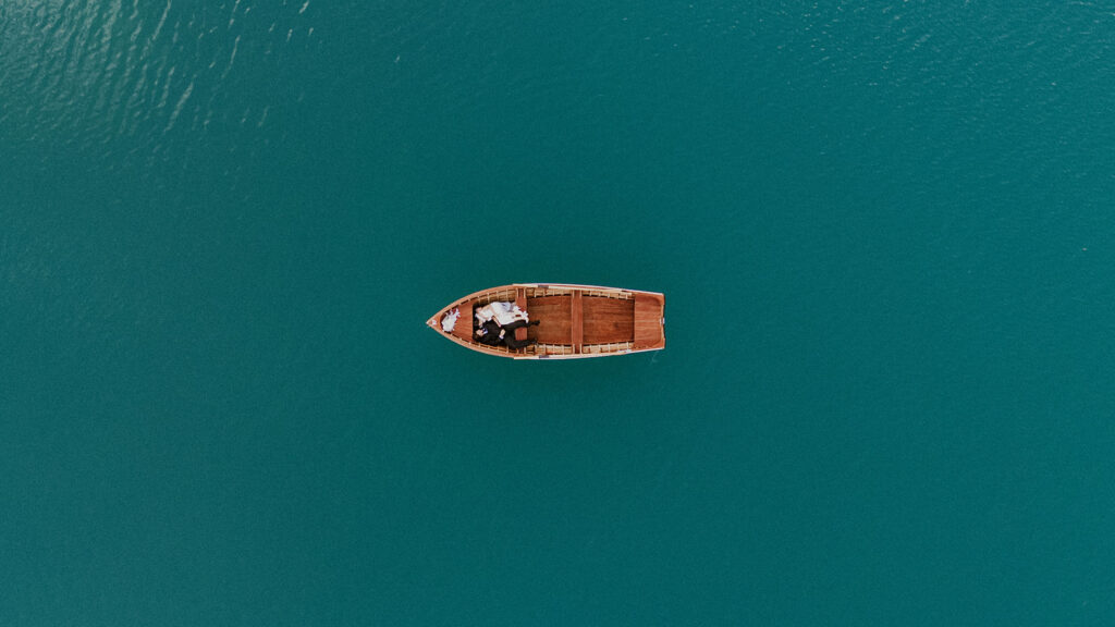 Couple laying in a canoe on Lago di Braies