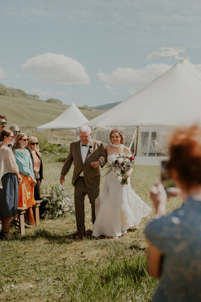 Crested Butte, Colorado wedding ceremony surrounded by wildflowers