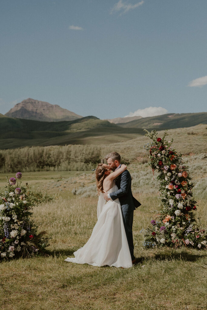 Crested Butte, Colorado wedding ceremony surrounded by wildflowers