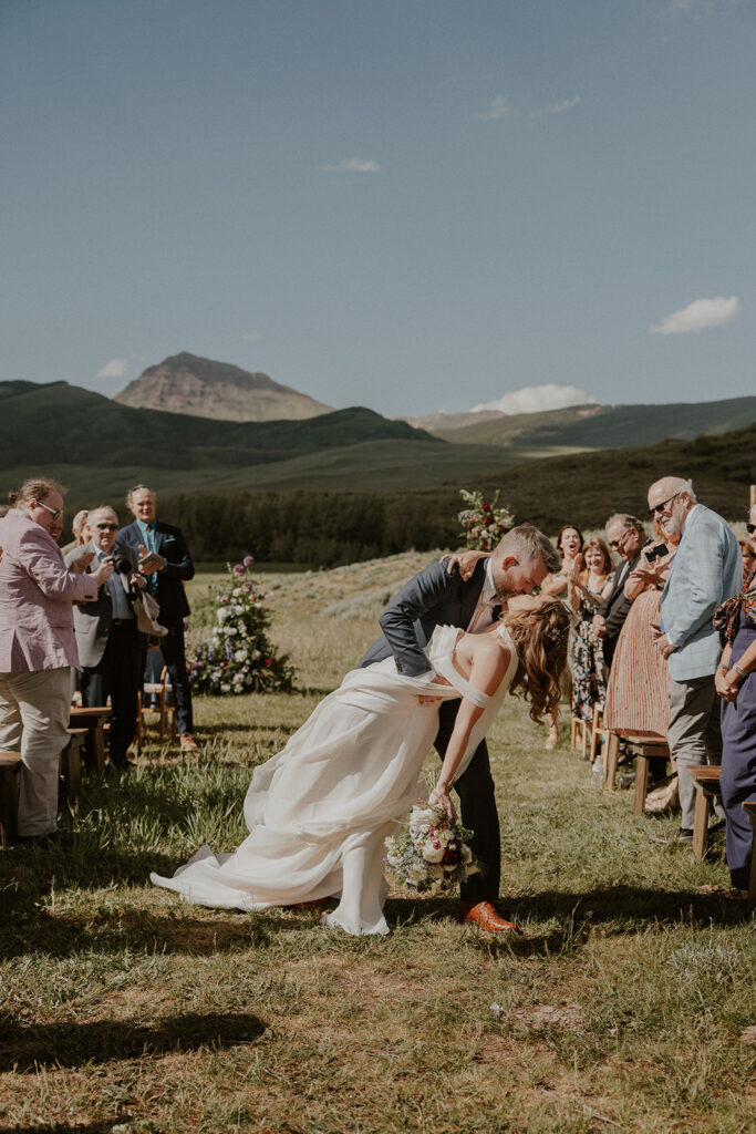 Crested Butte, Colorado wedding ceremony surrounded by wildflowers