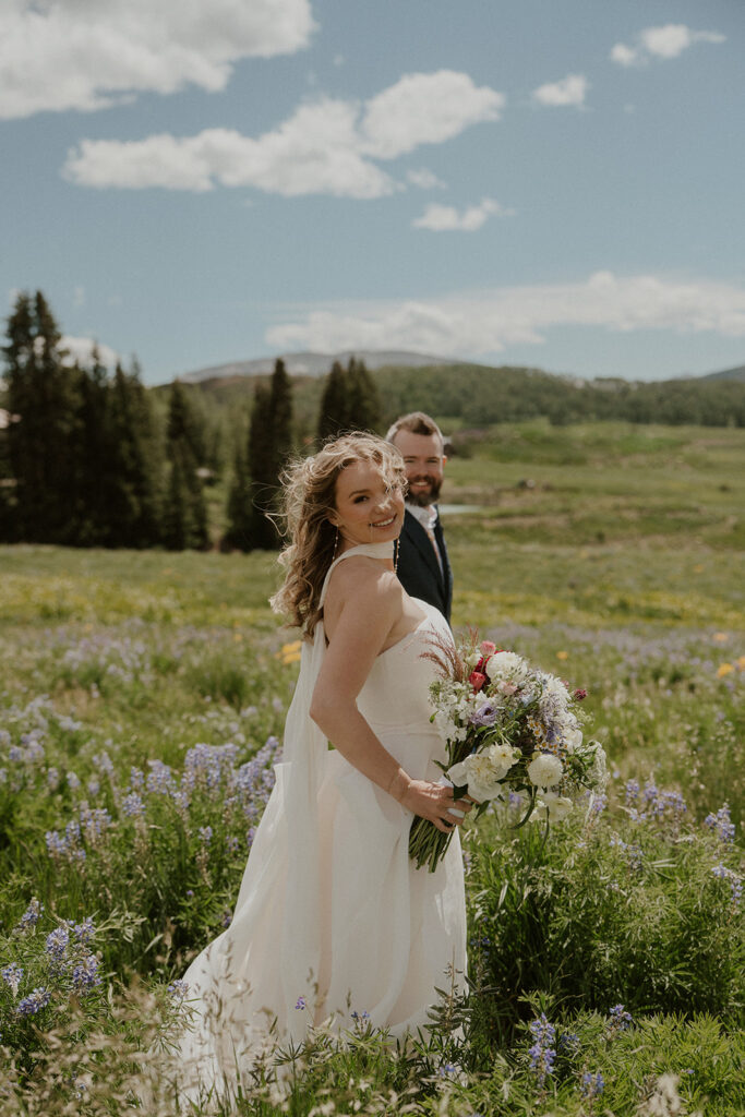 Sunny wildflower wedding portraits in Crested Butte, Colorado