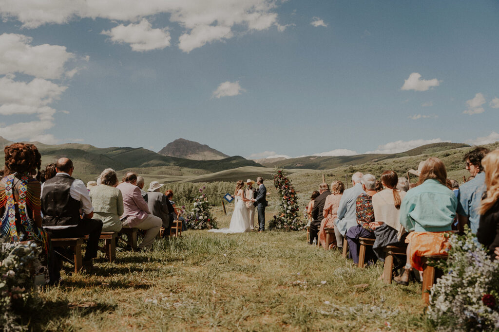 Crested Butte, Colorado wedding ceremony surrounded by wildflowers