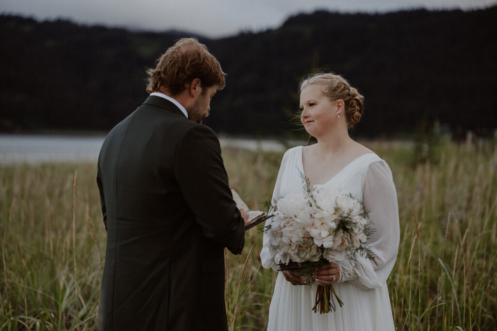 Alaska elopement vows near the ocean in Between Beaches