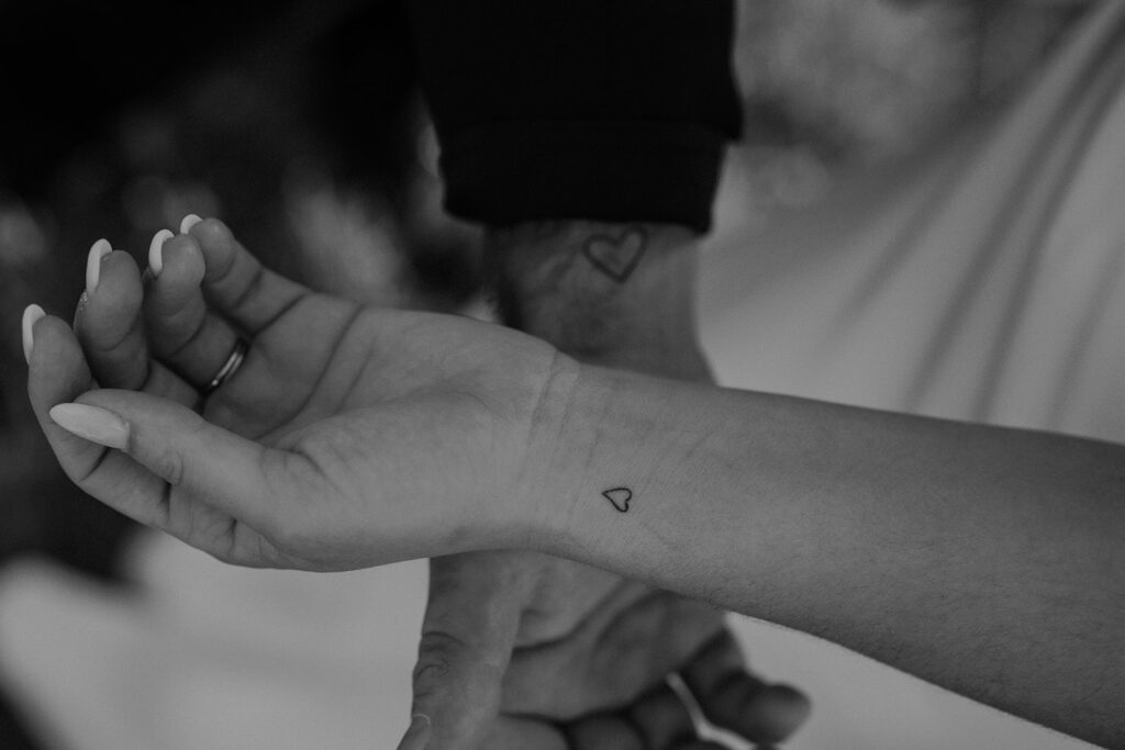 Bride and groom's matching heart tattoos