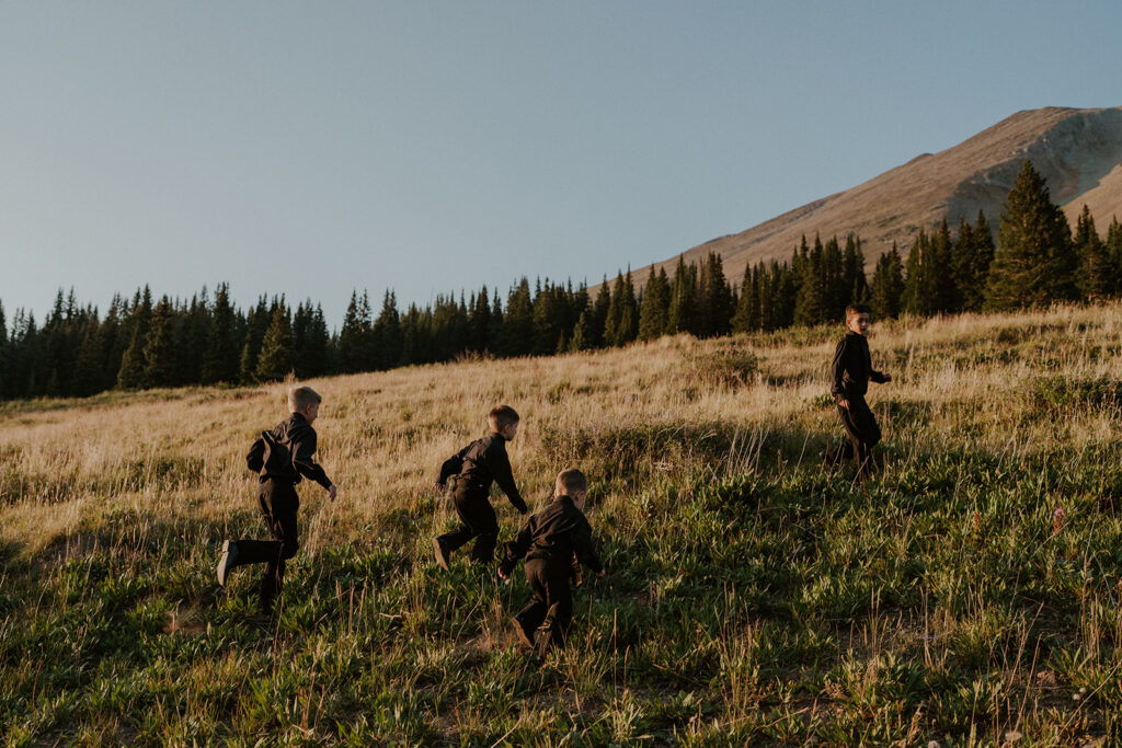 4 bows running up a hill in Breckenridge